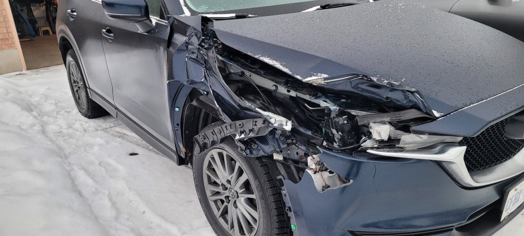 Car with extremely damaged front end.