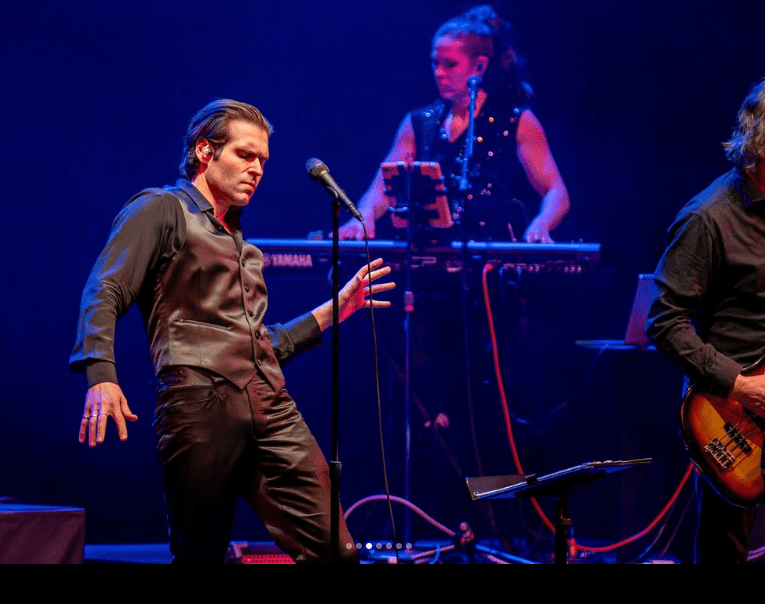 Singer, keyboardist, and part of guitarist on stage.