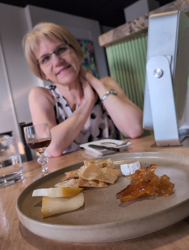 Cheese plate with honey and crackers and remaining port or sherry.